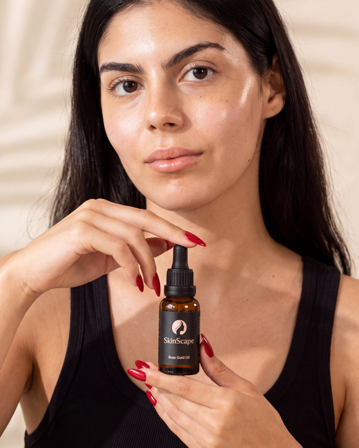 Serums, then oil. Warm it first.